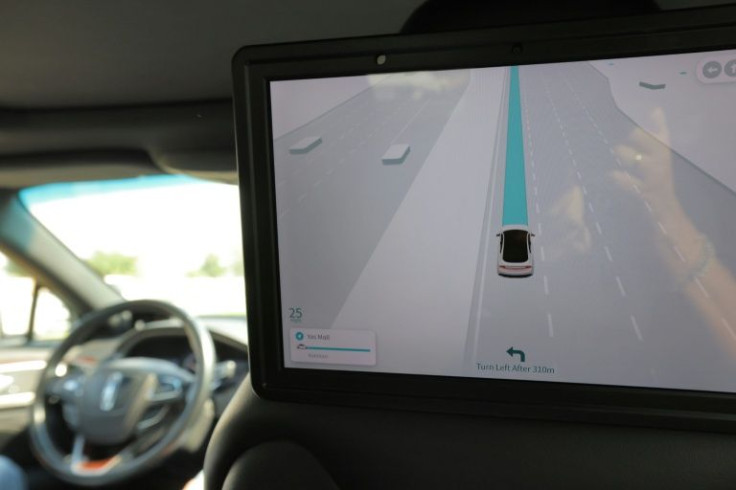 Passengers' view of monitor showing road navigation, from the interior of a self-driving taxi being used in a tech demonstration in the UAE capital Abu Dhabi