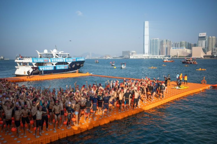 Swimmers wait at the starting point of the annual harbour swimming race in Hong Kong
