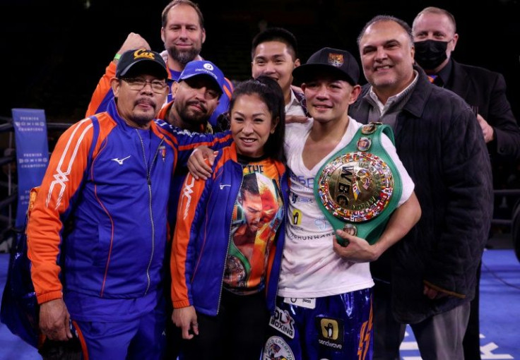 Nonito Donaire poses with his family members and boxing team after showing he still has plenty of fight left at age 39 after knocking out Reymart Gaballo with a thundering body shot in the fourth round of their title fight in Los Angeles