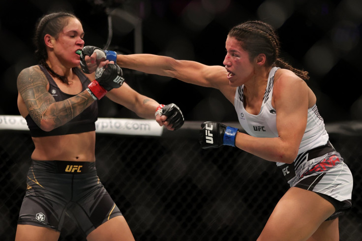  Julianna Pena (R) punches Amanda Nunes of Brazil