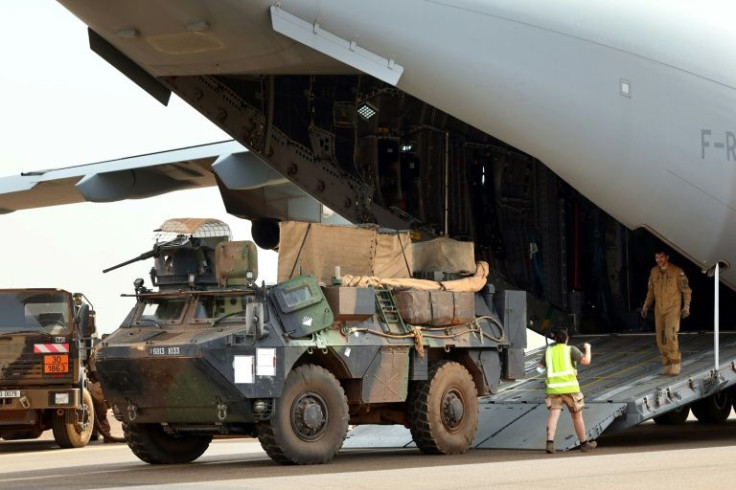 Equipment is loaded into a French air force transport plane at the army base in Gao