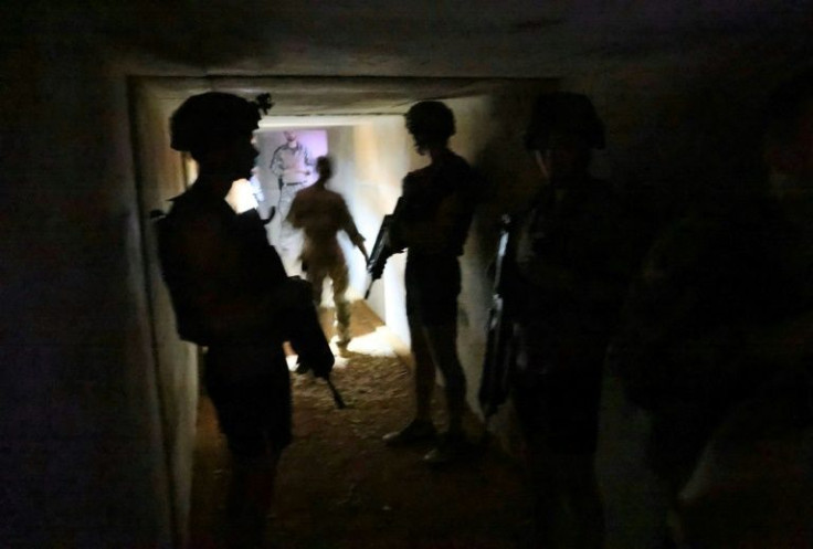 French soldiers take shelter during a rocket attack at the Gao army base in Mali