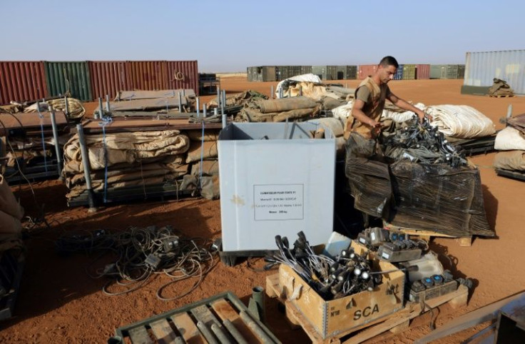 Soldiers are sorting through equipment in the northern Mali town of Gao