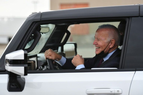 US President Joe Biden test drives an electric hummer as he tours the General Motors' electric vehicle plant in Detroit, Michigan on November 17, 2021