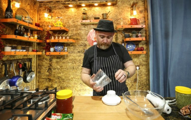 Syrian chef and refugee Warif Qassem prepares food for a YouTube lesson from his home in Gaza City