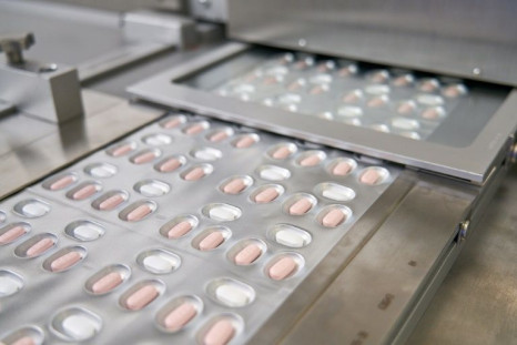 This file handout photo provided to AFP on November 16, 2021 by Pfizer shows the making of its experimental Covid-19 antiviral pills, Paxlovid, at its laboratory in Freiburg, Germany