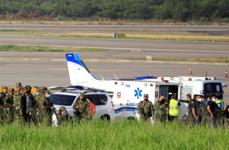 Military and emergency personnel swarmed Cucuta airport runways after explosions that left at least three people dead on December 14, 2021