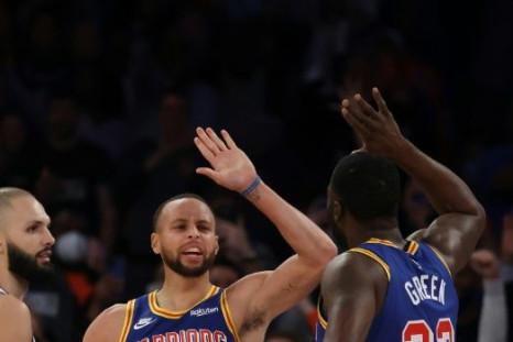 Stephen Curry celebrates with Golden State team-mate Draymond Green after breaking Ray Allen's three-point record