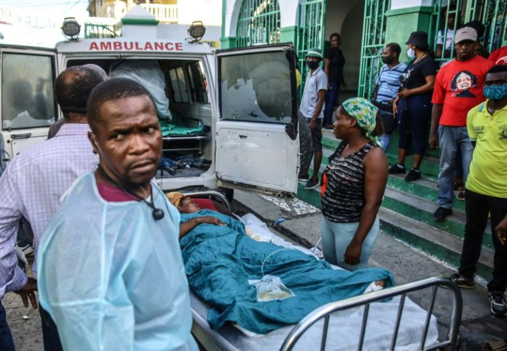 Injured people arrive at a hospital after a tanker truck exploded in Cap-Haitien -- medics said they feared they could not save all of the wounded, some of whom suffered critical burns