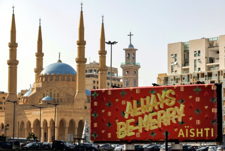 Trying to be positive: a Christmas greetings billboard in Beirut's Martyrs' Square, near the Mosque of Mohammed al-Amin and the Maronite Cathedral of Saint George