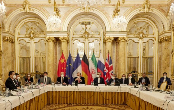 Representatives attend a meeting on December 9, 2021 of the joint commission on negotiations aimed at reviving the Iran nuclear deal in Vienna, Austria