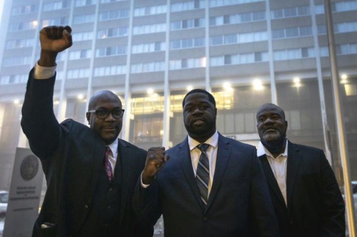 Philonise Floyd (L) and Rodney Floyd (R), George Floyd's brother, and nephew Brandon Williams (C) arrive at US District Court in St. Paul, Minnesota.