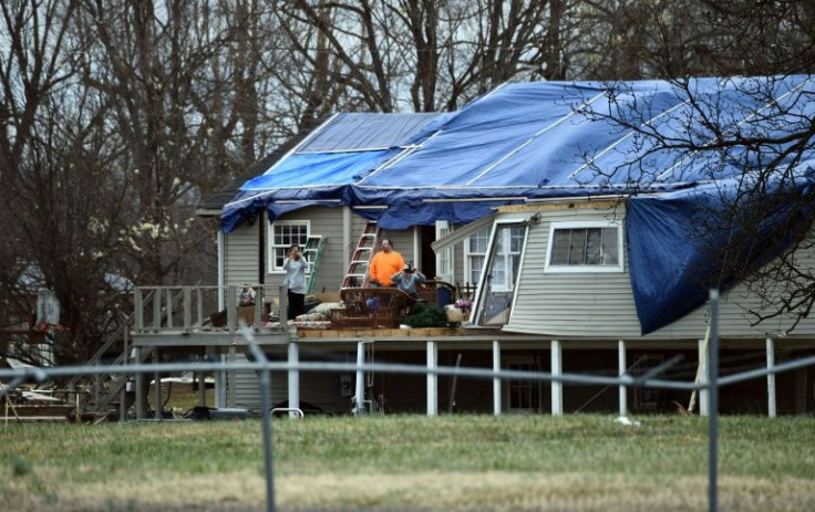 Tornado victims wait for the arrival of  US President Joe Biden in Mayfield, Kentucky