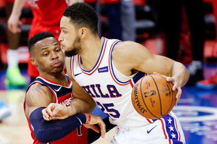 Russell Westbrook #4 of the Washington Wizards guards Ben Simmons #25 of the Philadelphia 76ers