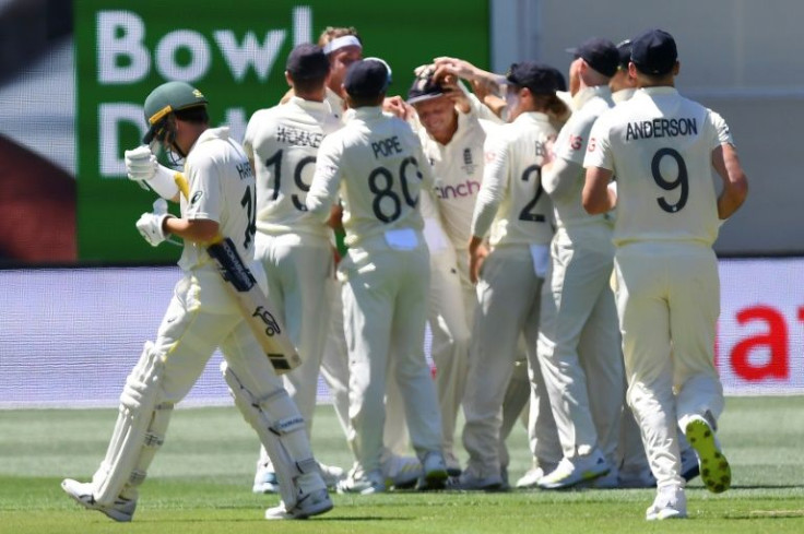 England celebrate the wicket of Marcus Harris (left), who scored just three
