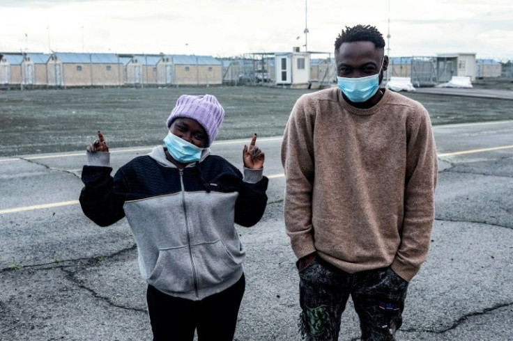 Cameroonian asylum seekers Grace Enjei and Daniel Ejube pose for the cameras at Cyprus's Limnes accommodation centre on the eve of their departure for a new life in Italy organised by Pope Francis