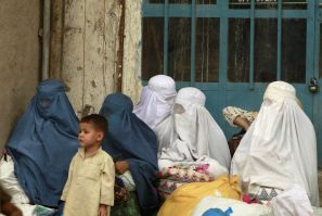 Afghan women wait for transportation in Kabul