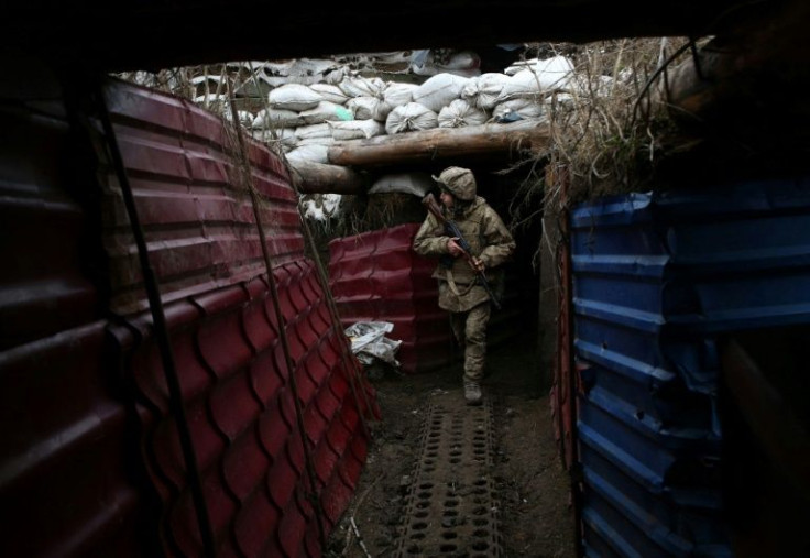 Stationed in the heavily damaged village of Pisky just outside the separatist stronghold city of Donetsk, soldiers patrol trenches in freezing temperaturesÂ