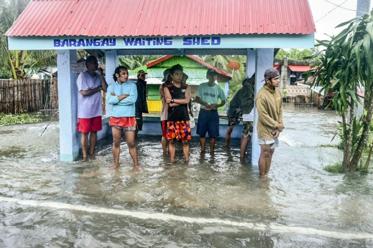 More than 300,000 people fled their homes and beachfront resorts as Typhoon Rai pummelled the southern and central regions of the country