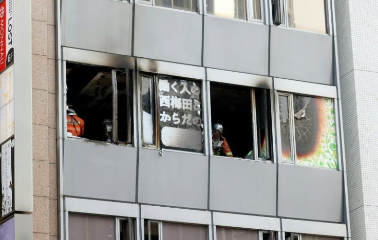 The charred interior of the fourth floor of the narrow office building was visible through broken and blackened windows