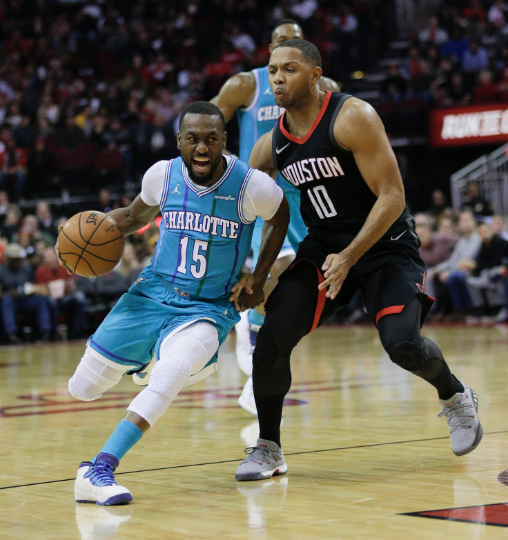 Kemba Walker #15 of the Charlotte Hornets drives around Eric Gordon #10 of the Houston Rockets