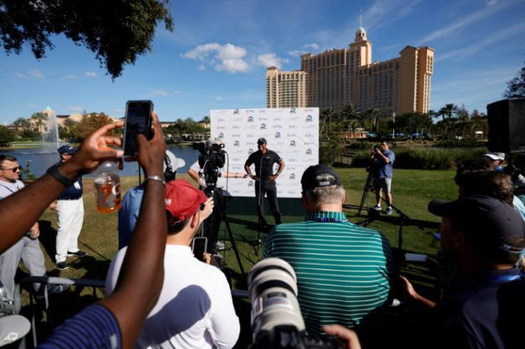 Moving the needle: Tiger Woods is interviewed by the press after a pro-am round ahead of the PNC Championship family tournament at the Ritz-Carlton Golf Club in Orlando, Florida