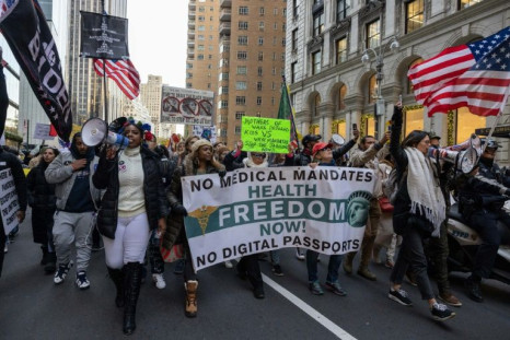Demonstrators march during an anti-vaccine mandate protest in New York on November 20, 2021