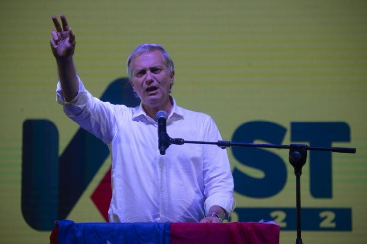 Chilean presidential candidate Jose Antonio Kast speaks to supporters during his closing campaign rally at Araucanos Park in Santiago, on December 16, 2021