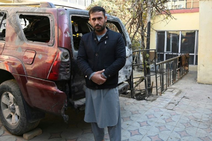 Aimal Ahmadi, who lost his daughter Mailka and his brother Zimarai Ahmadi as well as eight other relatives in a wrongly directed US drone strike in Kabul on August 29, stands outside his house on December 14, 2021