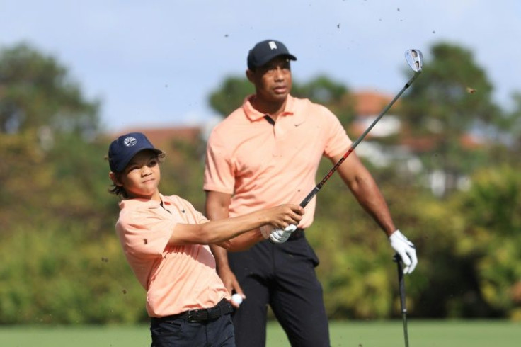 Tiger Woods looks on as son son Charlie plays a shot during their 10-under-par round at the PNC Championship family tournament in Florida on Saturday