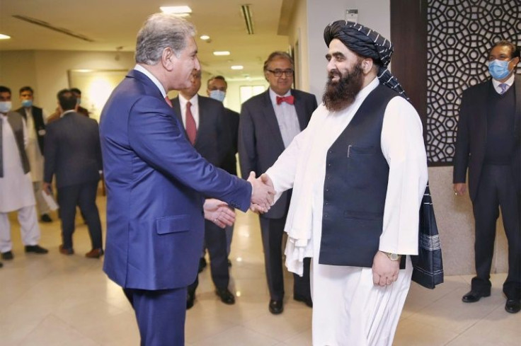 Taliban foreign minister Amir Khan Muttaqi (R) is among the delegates at a summit of Islamic countries in Islamabad aimed at relieving the humanitarian crisis in Afghanistan