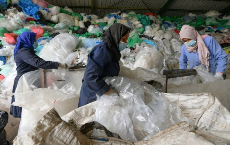 Employees sort through piles of plastic waste at African Recycling, one of the few recycling companies in Tunisia