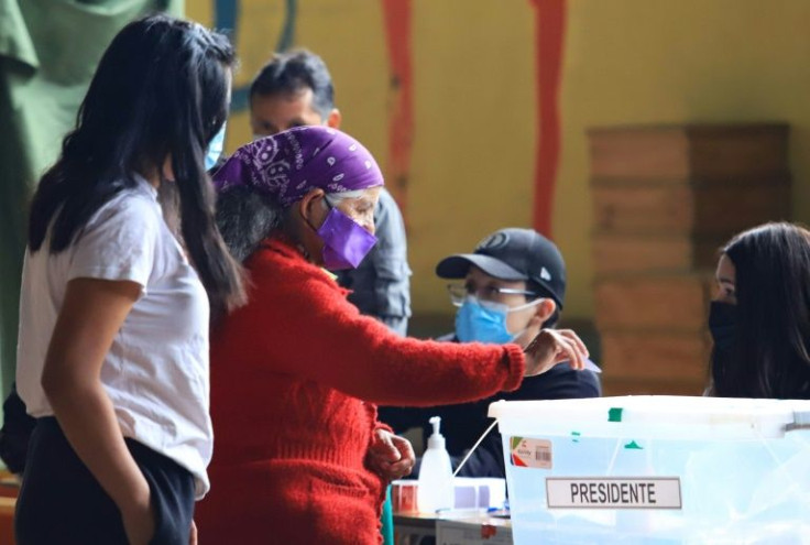 A Mapuche woman cast her vote at a polling station in Temuco, during the runoff presidential election in Chile on December 19, 2021