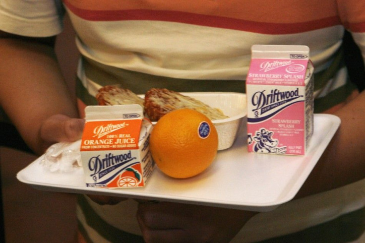 Students have a nutrition break mid-morning consisting of milk, juice, an orange and either mini sausage roll or Vegetarian Italian bagel at Belmont High School in Los Angeles, California May 18, 2009.