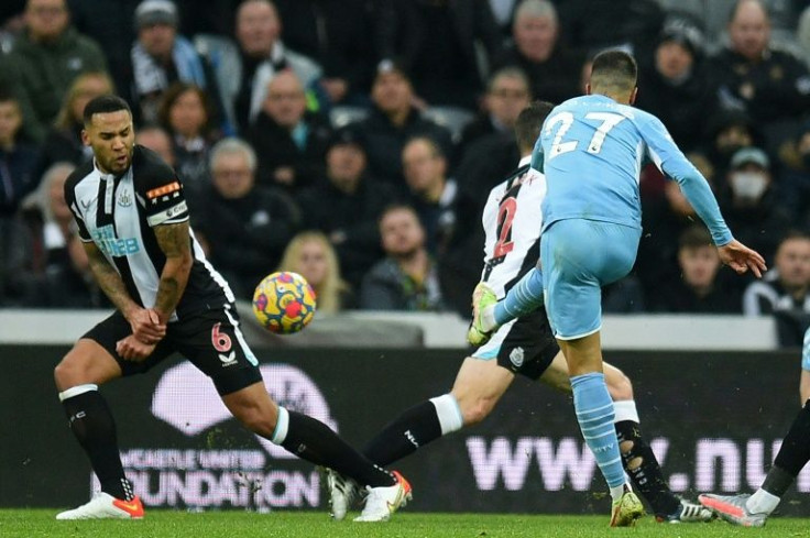 Manchester City's Joao Cancelo scores his side's second goal against Newcastle