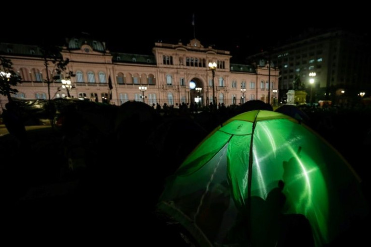 People camp at Plaza de Mayo during a vigil for the 20th anniversary of Argentina's 'great crisis,' in Buenos Aires on December 19, 2021