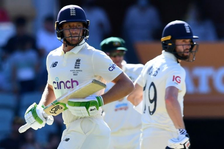 England's Jos Buttler (L) and Chris Woakes showed dogged resistance as England tried to salavge a draw in Adelaide
