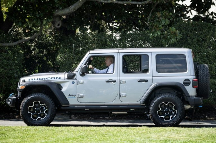 US President Joe Biden, seen here driving an electric Jeep Wrangler Rubicon 4xe, has made fighting climate change a priority, and announced new standards that would raise average fuel efficiency for cars and trucks to cut emissions