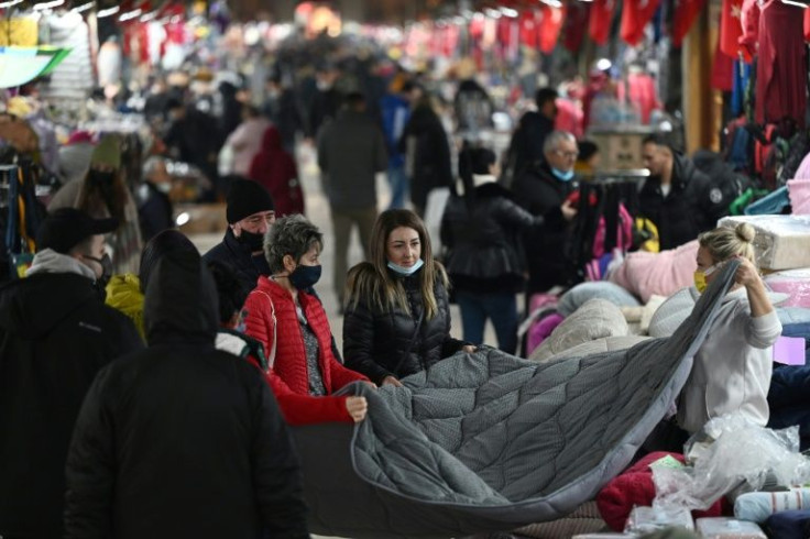 Turkish traders say the lira's steep losses mean they make a lot less money despite the big jump in sales
