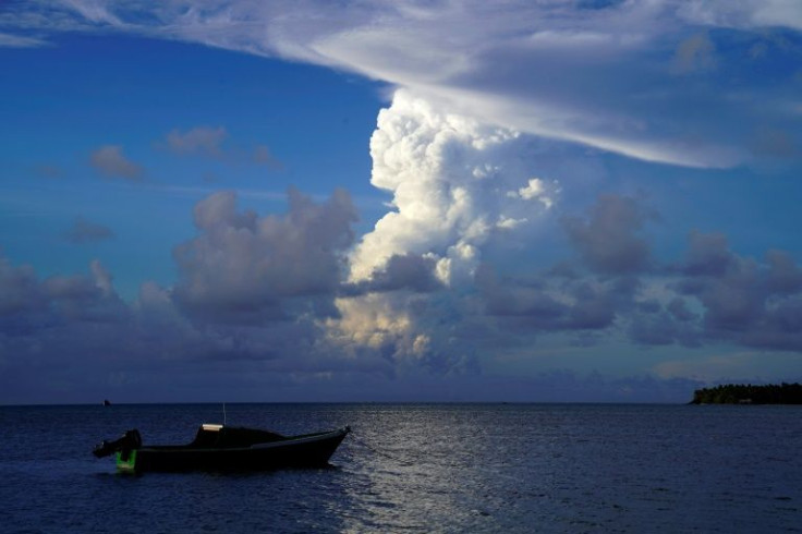 White gaseous clouds rise from the Hunga Ha'apai eruption, seen from near Tonga's capital Nuku'alofa