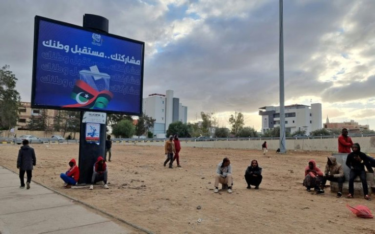 A roadside billboard in the capital Tripoli urges Libyans to turn out to vote in Friday's presidential election even as it looks ever less likely it will go ahead