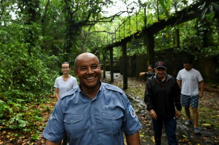 Corazon de Jesus Aguino, a forest ranger, guides tourists around what used to be the prison at Gorgona Island