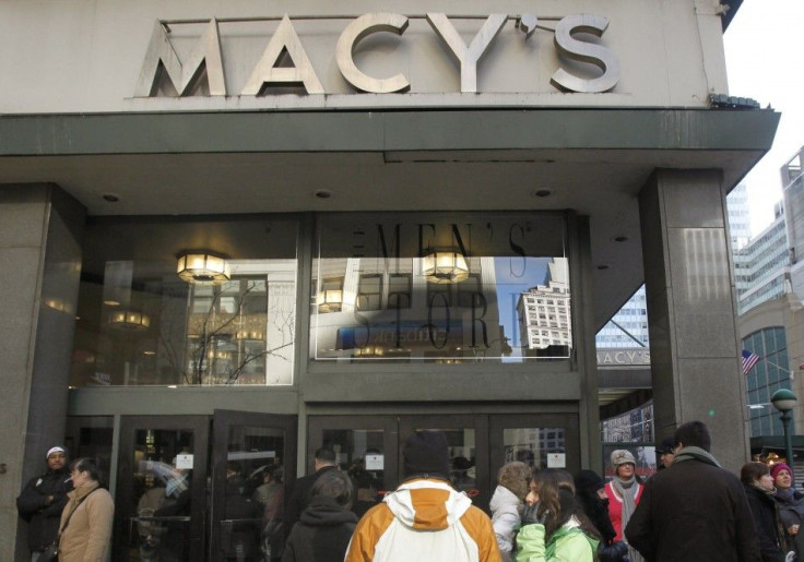 People wait for a Macy's department store to open in New York January 7, 2010. U.S. retailers including Macy's posted higher December sales and raised profit forecasts as they carefully managed promotions to lure shoppers during the holidays.