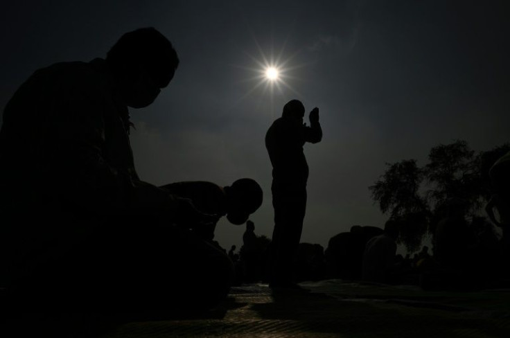 Muslim devotees offer Friday prayers in an open ground in Gurgaon, after several prayer sites were closed by the authorities