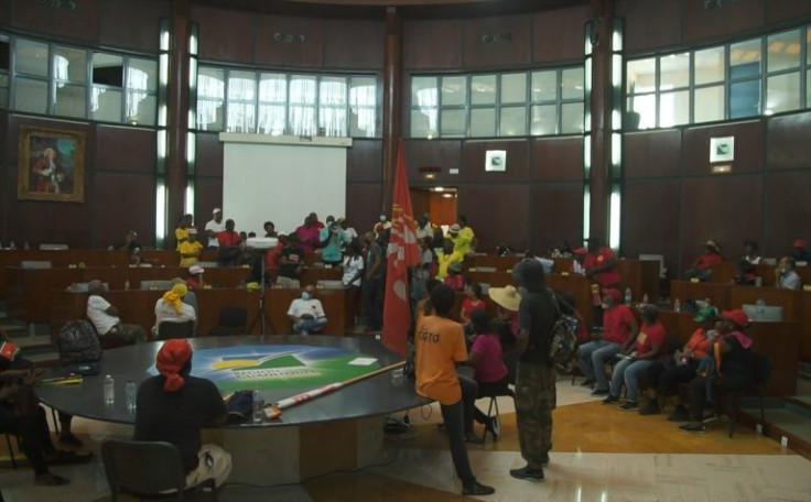 Protesters first entered the debating chamber of the regional council while it was meeting on Thursday
