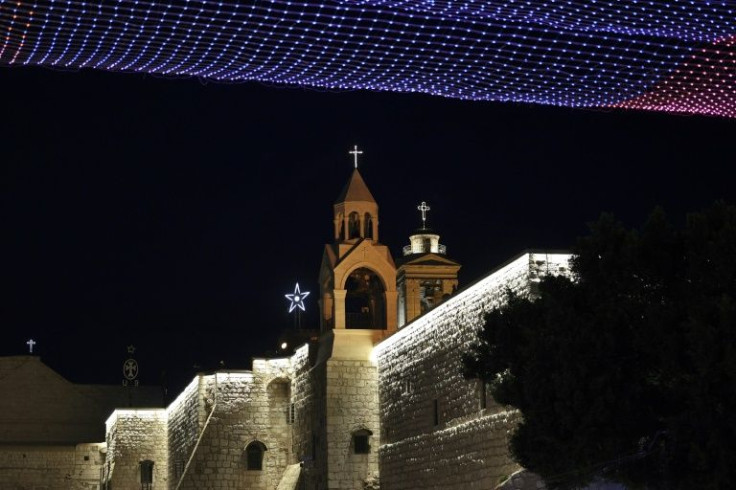 Lights bedeck the Church of the Nativity in Bethlehem on Christmas Eve 2021, its second year under the shadow of the pandemic