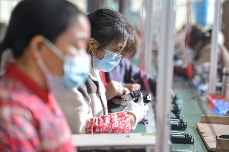 Assembly-line workers at a factory in Fuyang in eastern China