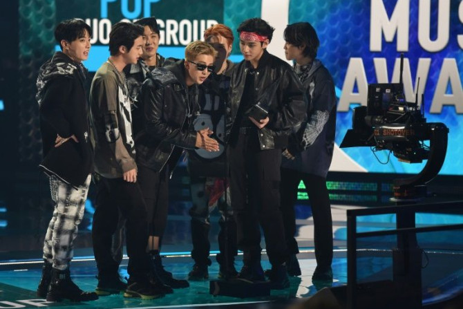 This handout photo courtesy of American Broadcasting Companies, Inc. / ABC shows South Korean band BTS accept the Favorite Pop Duo or Group award onstage during the 2021 American Music Awards at the Microsoft Theater in Los Angeles