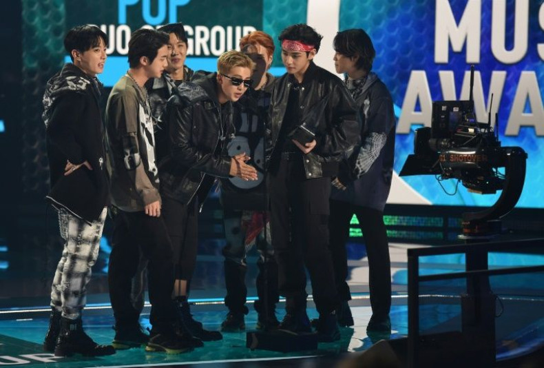 This handout photo courtesy of American Broadcasting Companies, Inc. / ABC shows South Korean band BTS accept the Favorite Pop Duo or Group award onstage during the 2021 American Music Awards at the Microsoft Theater in Los Angeles