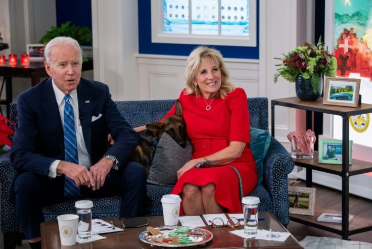 US President Joe Biden and US First Lady Jill Biden, with their new dog Commander, speak virtually with military service members